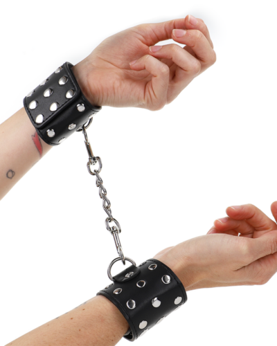 Kink - Wrist Restraints With Snap Fasten Full Of Rivets Black Adjustable 19-24 cm X 5.5 cm